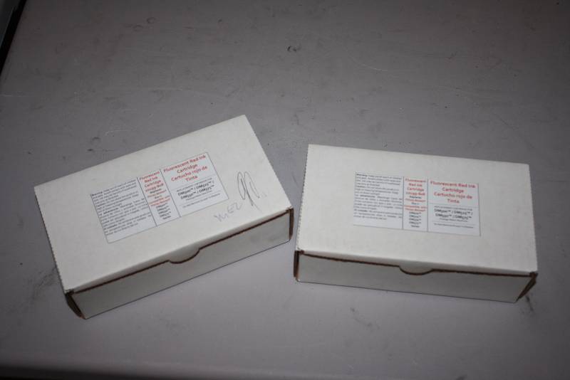 lot 56 image: Lot of (2) Fluroescent Red Ink Cartridge For DM500525550575.