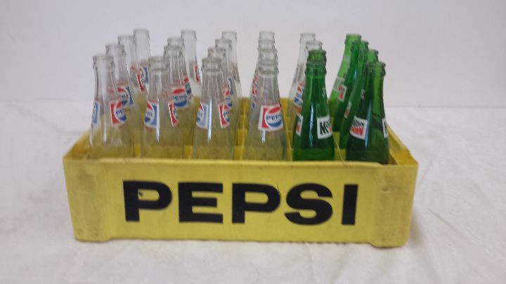 lot 85 image: case of pepsi and Mt. Dew bottles