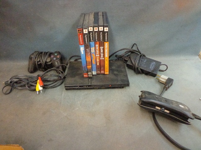 lot 93 image: PS2 slim with games