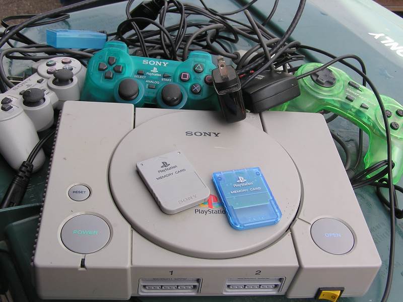 lot 9 image: SONY PLAYSTATION CONTROLLERS AND CORDS