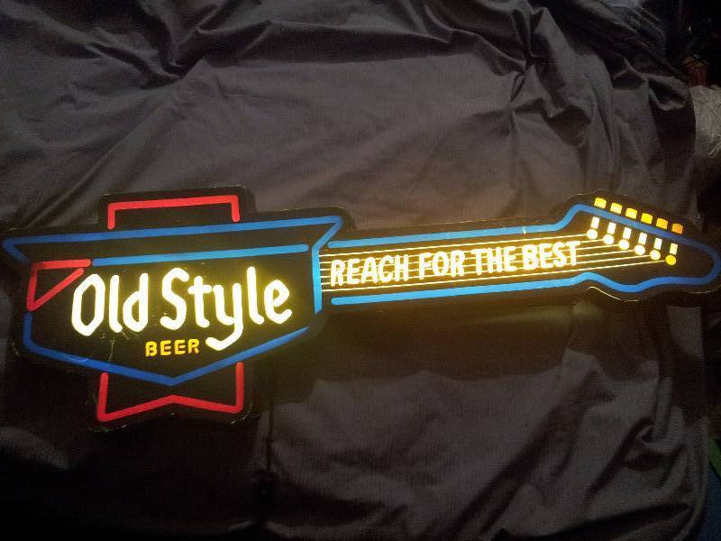 lot 63 image: Old Style Guitar Beer Sigh - Roughl...