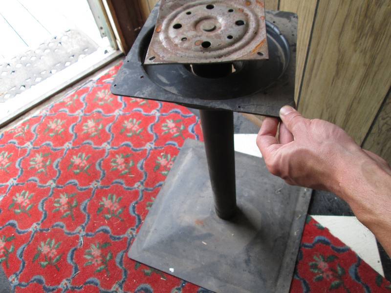 lot 155 image: Metal stand with spinning top that ...