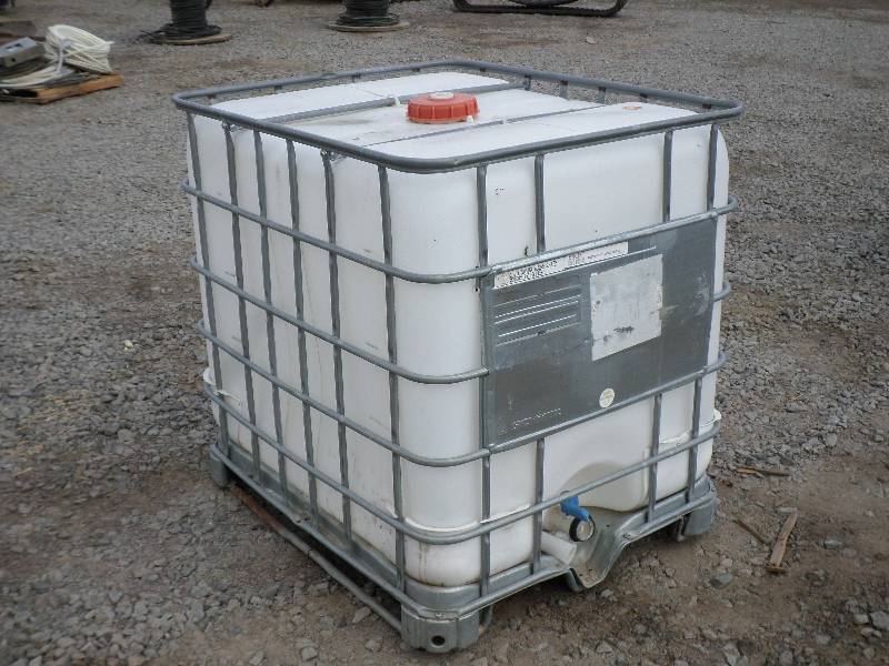 lot 7 image: Schutz Industrial 300-Gallon Caged ...