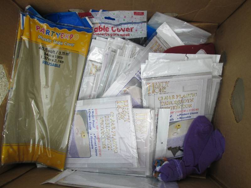 lot 36 image: bananna box of plastic table covers...