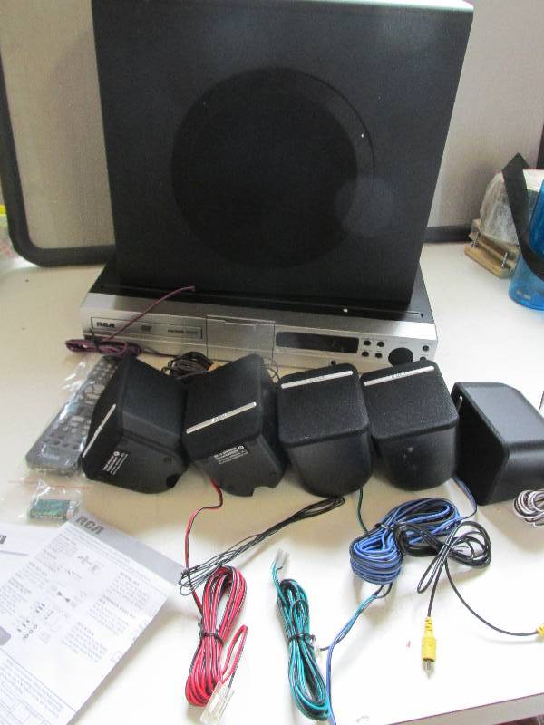 lot 84 image: RCA DVD home theater system for Ipo...
