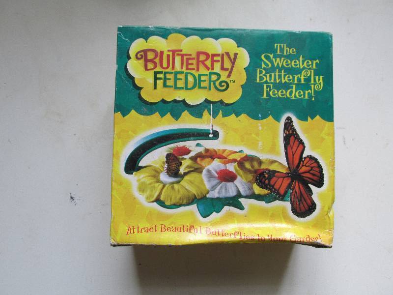 lot 143 image: ne win the box butterfly feeder...