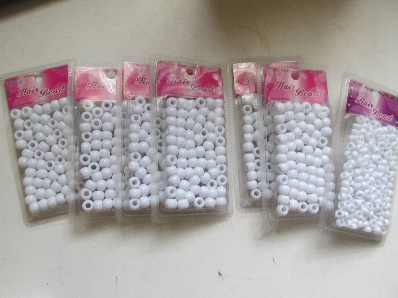 lot 146 image: 7 packs hair beads small and medium...