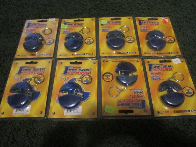 lot 229 image: 8 tool mate keychains...