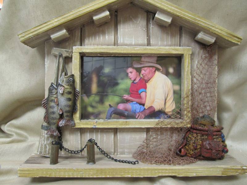 Frame with fish and tackle box...
