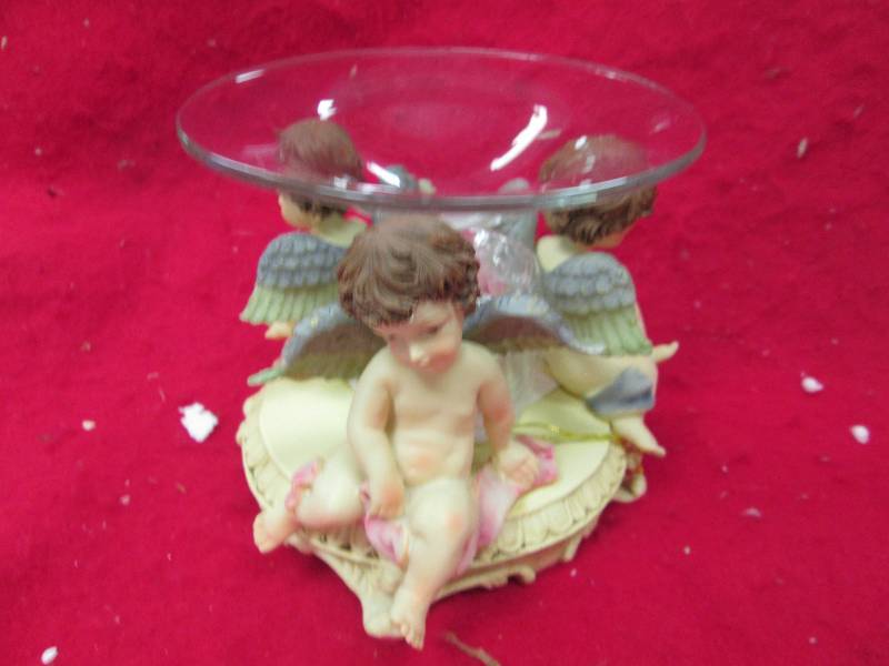 3 angle on a table with candle in t...