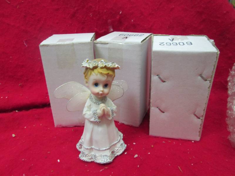 Qty 4 Angels white...