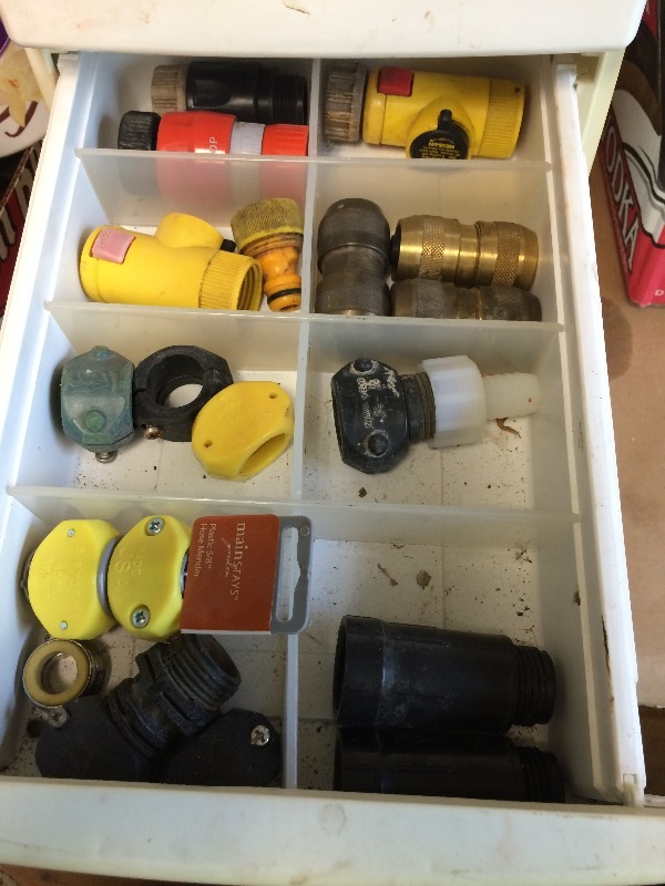 lot 21 image: Assorted Garden Hose adaptors, fittings, sprayers and organizer is included