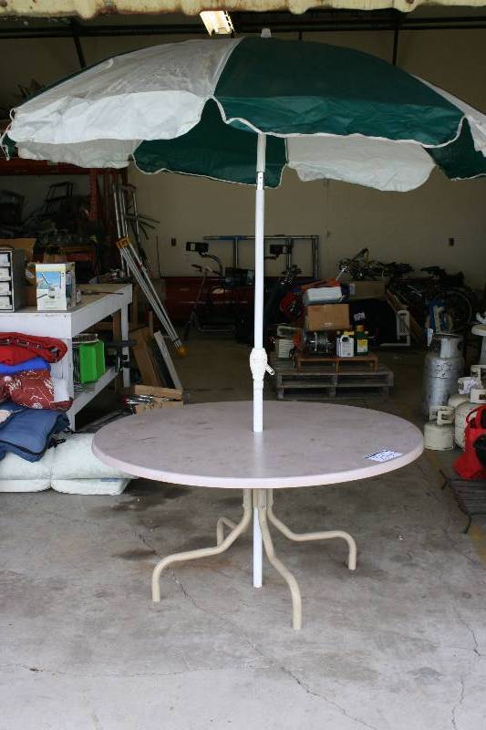 lot 270 image: Lot of (2) Circular Tables wUmbrella 60 Diameter.