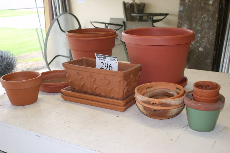 lot 296 image: Table Lot Including Terra Cotta Pots & Bases Plastic Pots And More.