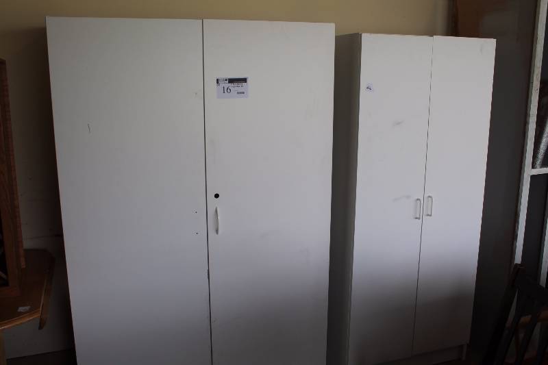 lot 16 image: Lot of  (2) Cabinets wDouble Doors & Storage Shelves Clothes Racks Cubbies White Finish wHandles 21 x 48 x 72 25 x 30 x 70.