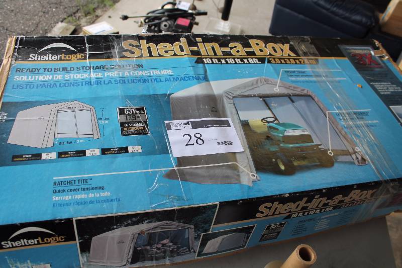 lot 28 image: Shelter Logic Shed-In-A-Box Includes Cover, Frame, Hardware, Temporary Anchors 10 x 10 x 8.