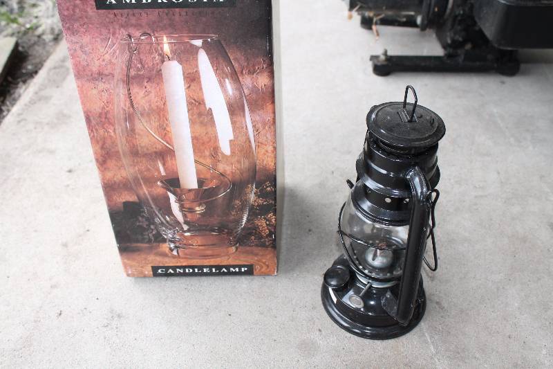 lot 27 image: Lot of (2) Including Candlelamp wGlass Contair & Metal Holder Metal Lantern wGlass Bulb.
