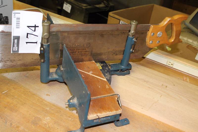lot 174 image: Metal Miter Box wAdjustable Angle Includes Stanley Wood Saw.