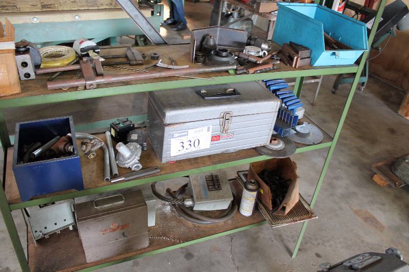 lot 330 image: Shelving Lot Including Tool Box Metal Hardware Extension Box wCord And More Includes Only Bottom 3 Shelves Shelving Unit Not Included.