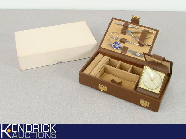 lot 39 image: NEW Vintage Griffon Germany Traveling Manicure, Jewelry Box, and Clock Kit