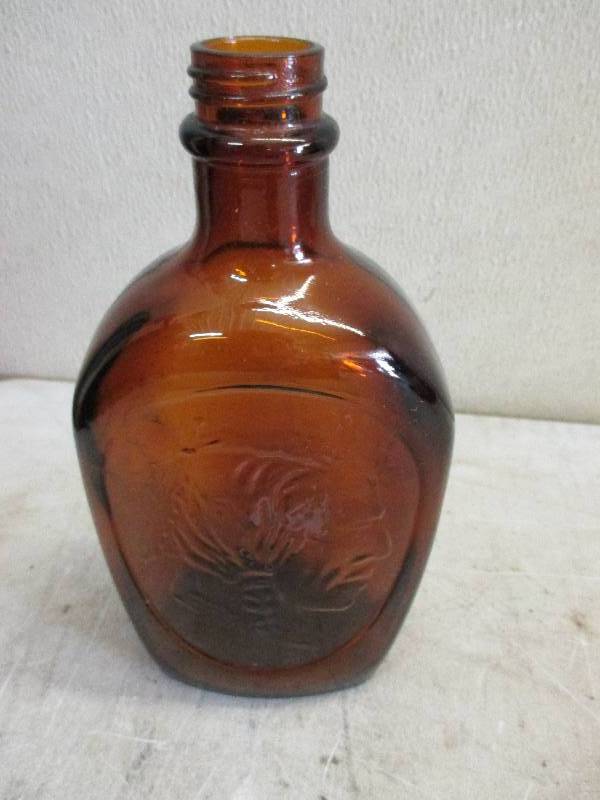 lot 97 image: Log cabin bottle