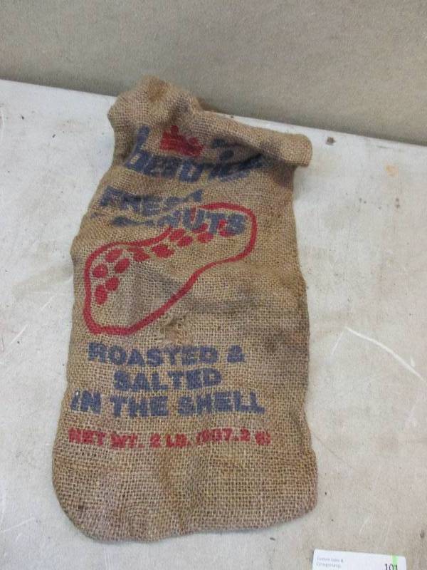 lot 101 image: Vintage burlap peanut sack