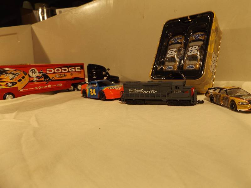 lot 9 image: Racecars in a Tin, Vintage Toy Car, Mad Magazine Dodge Bus, Traincar