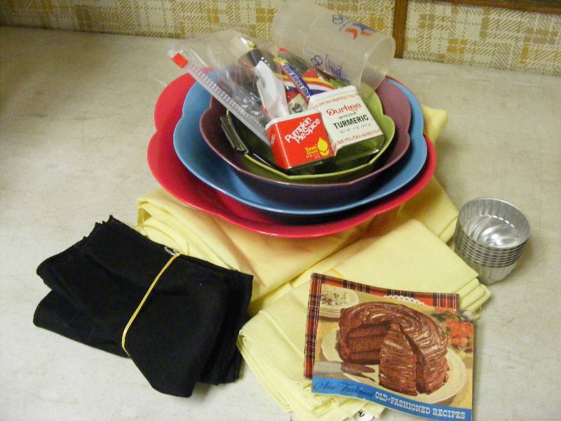 lot 303 image: Melamine Nesting Serving Bowls, Metal Custard Cups, Tablecloth and Napkins, Refridgerator Magnets