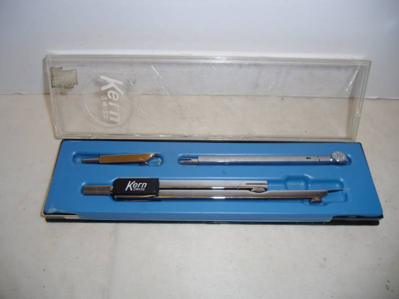 lot 31 image: Vintage Office -  Slide Ruler, Bates List Finder,  Pencil Sharpener, Stamp  Envelope Sealer