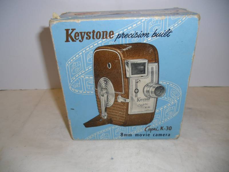 lot 32 image: Old Cameras - 8mm Movie Camera, Brownie Bullet Camera, Film Reels, Transistor Radio