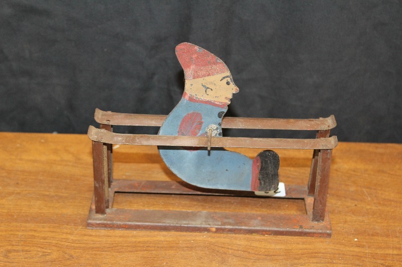 lot 23 image: Antique Tin Spinning Man Toy