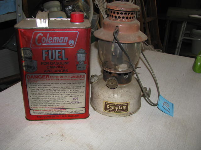 lot 170 image: vintage KampLite LRL22 lantern and 12 can of Coelman fuel