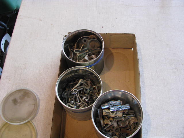 lot 172 image: three cans of old window attachments