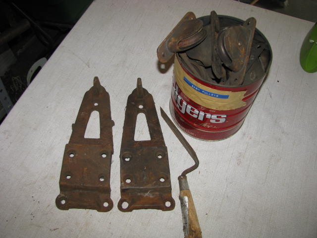 lot 176 image: can full of vintage sash pulleys two large hinge plates
