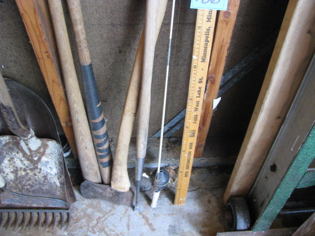 lot 186 image: two vintage bat, child fishing pole, axe, yardsticks and weed puller