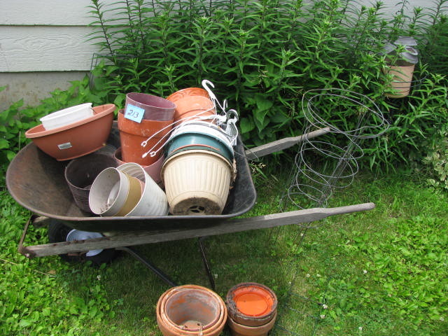 lot 213 image: wheelbarrow and misc garden supplies
