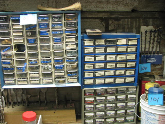 lot 99 image: three bins full of parts