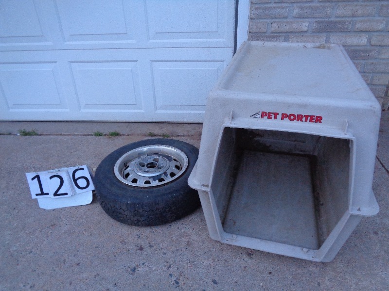 lot 126 image: Dog Kennel and Tire