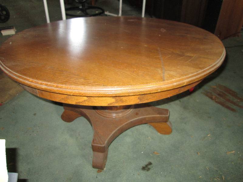 lot 31 image: Round solid wood table, 31 across,...