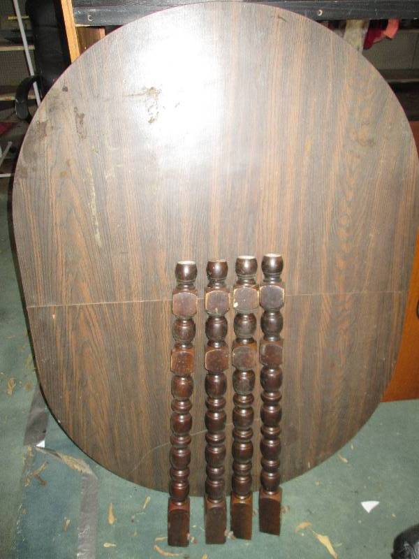 lot 43 image: Oval topped table with legs removed...