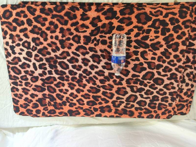 lot 31 image: 4 leopard floor mats