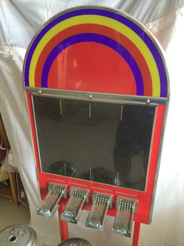 lot 104 image: coin operated sticker and candy machine