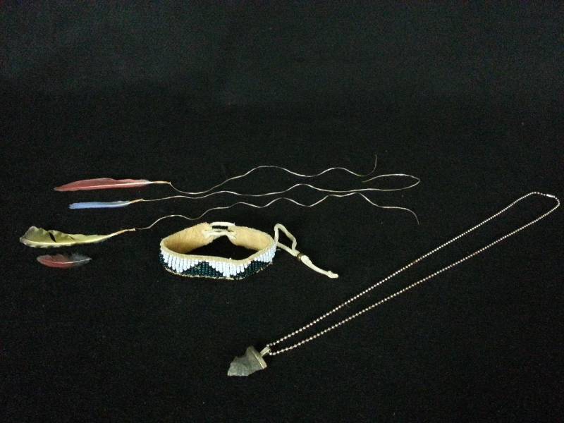 lot 54 image: Sterling Arrow Head Necklace, Hand Beaded Bracelet, and (3) Feather Strings