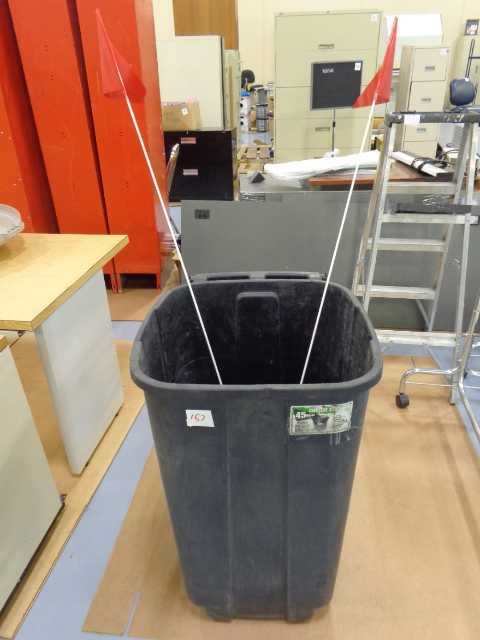 lot 157 image: Garbage can with flagpoles