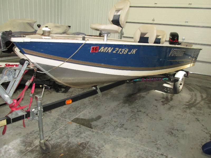 lot 1 image: 16 foot Voyager boat on a Karavan t...