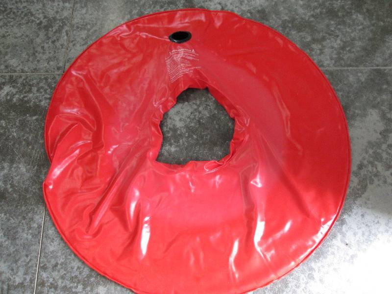 lot 12 image: Large red inflatable tube with cup ...