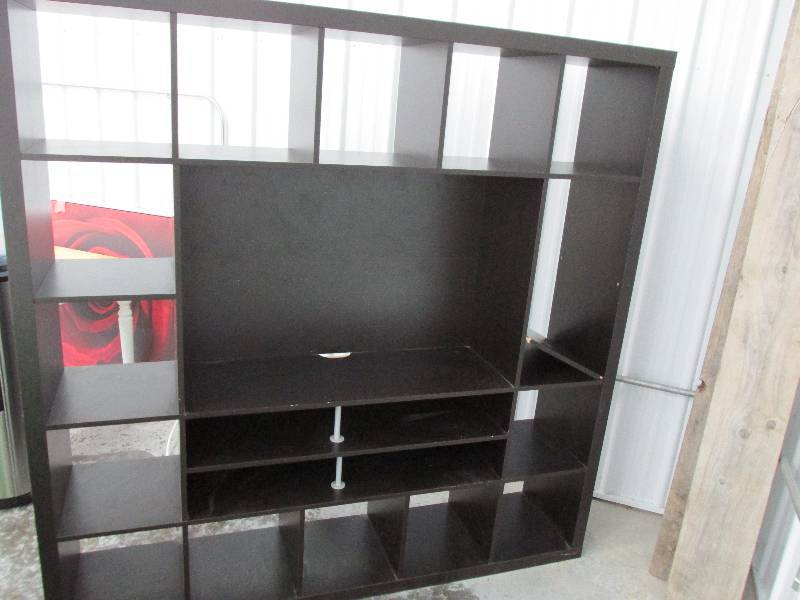 lot 45 image: Large black entertainment center, a...