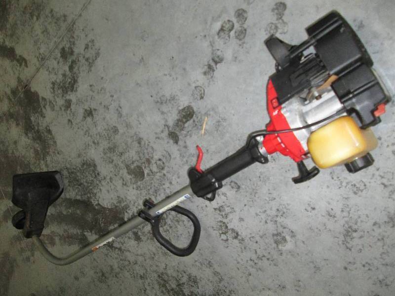 lot 70 image: Yard Machines gas powered weed trim...
