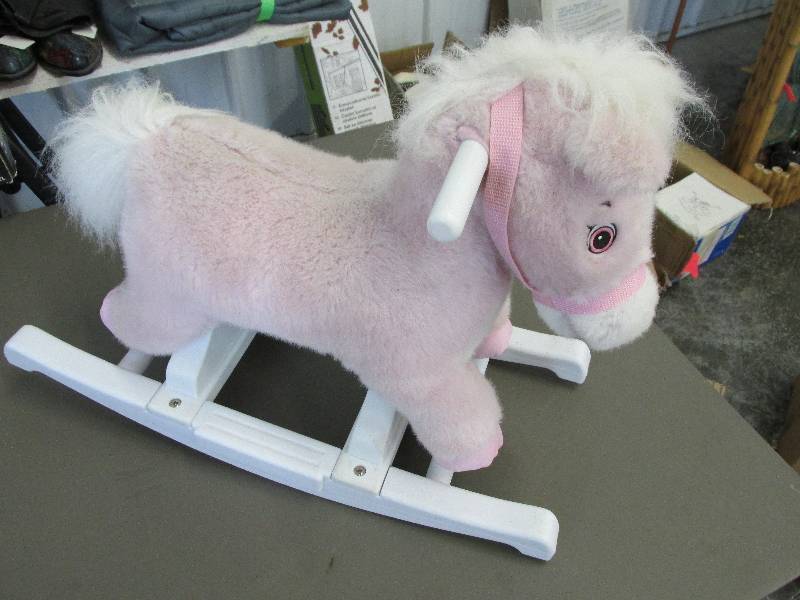 lot 179 image: Pink plush rocking horse with plast...