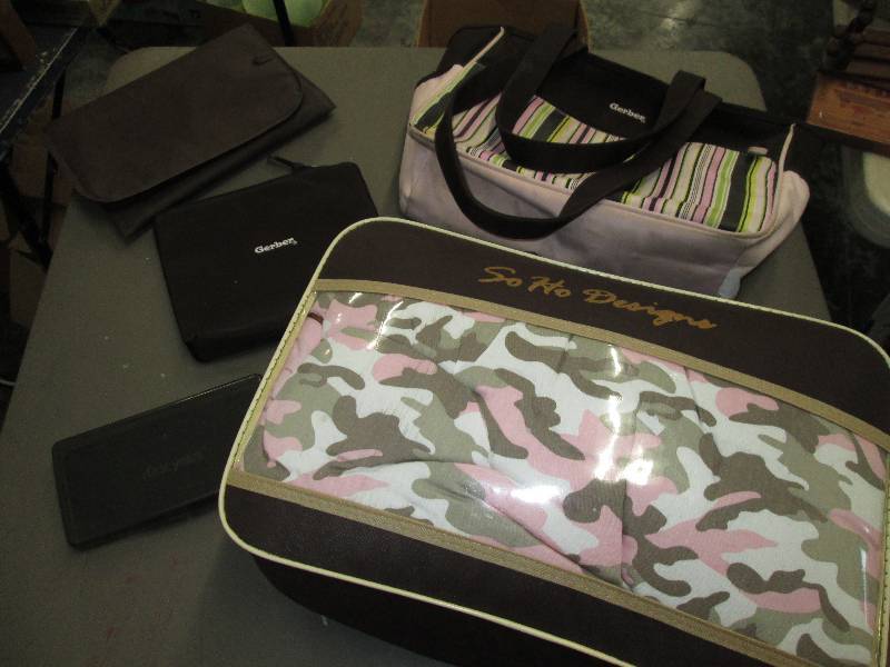 lot 212 image: Gerber diaper bag and So Ho designs...